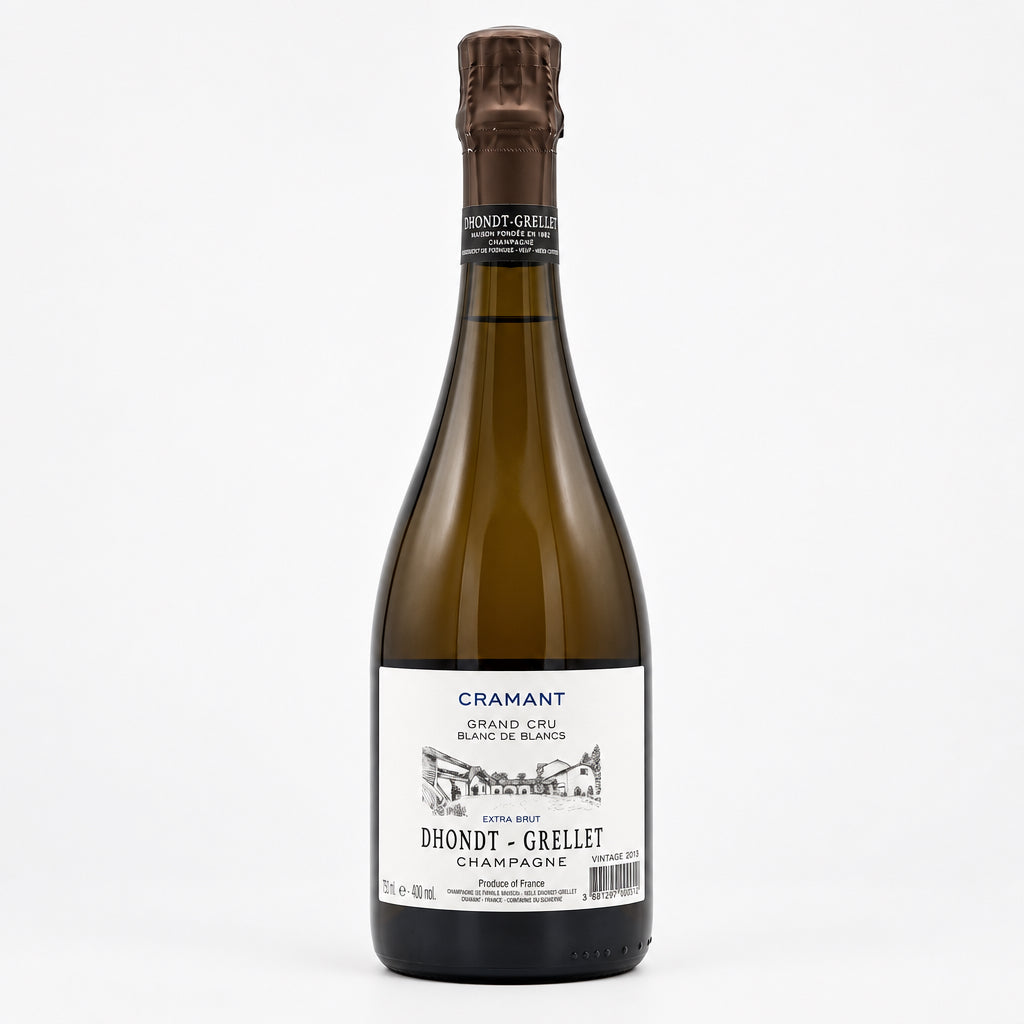Bottiglia di Champagne Dhondt Grellet Cramant Grand Cru Blanc de Blancs in primo piano